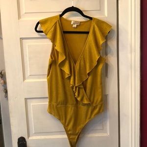 Yellow gold sparkly ruffle body suit